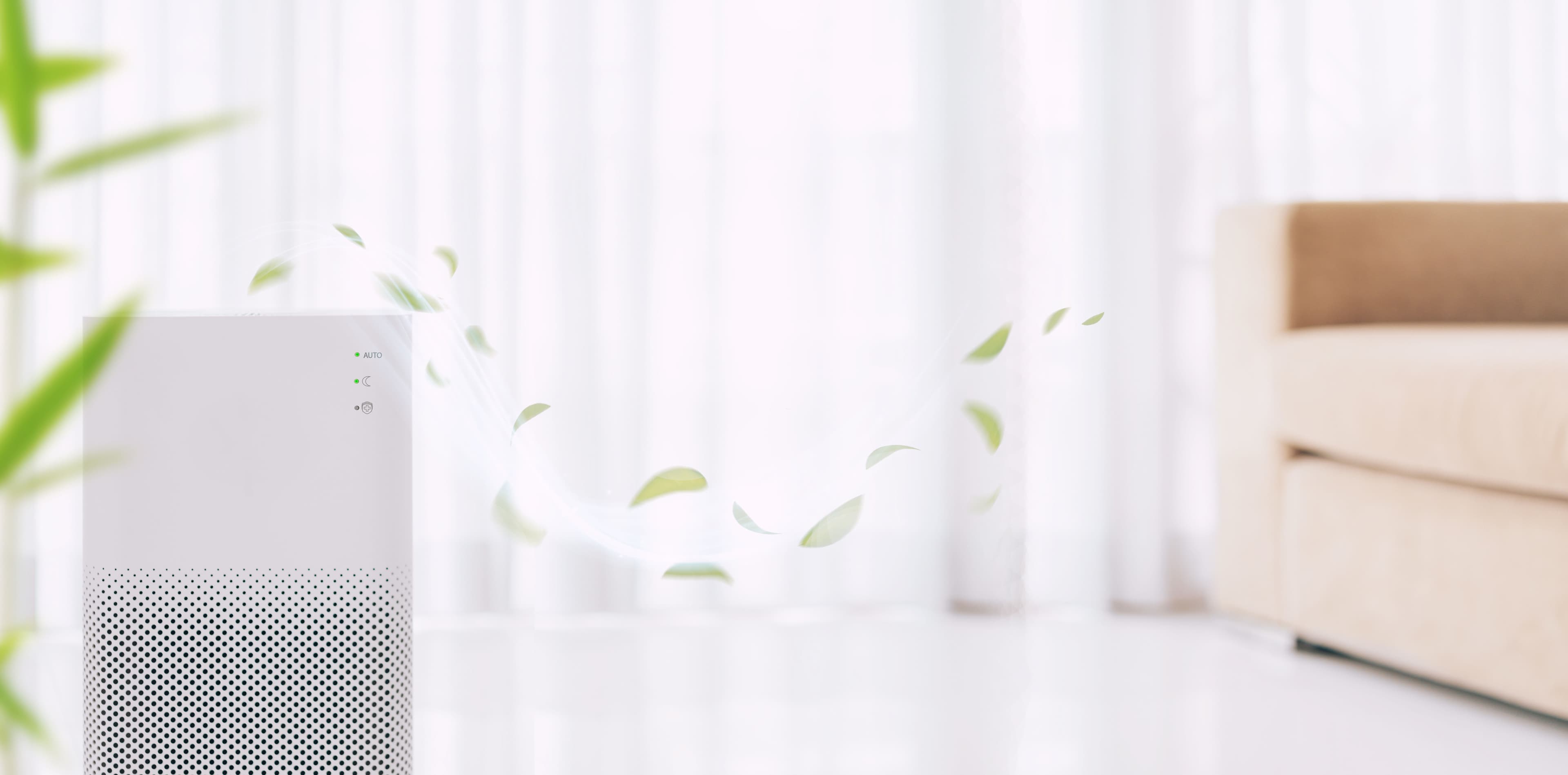 Air purifier with green leaf particles, enhancing indoor air quality in a bright living space.